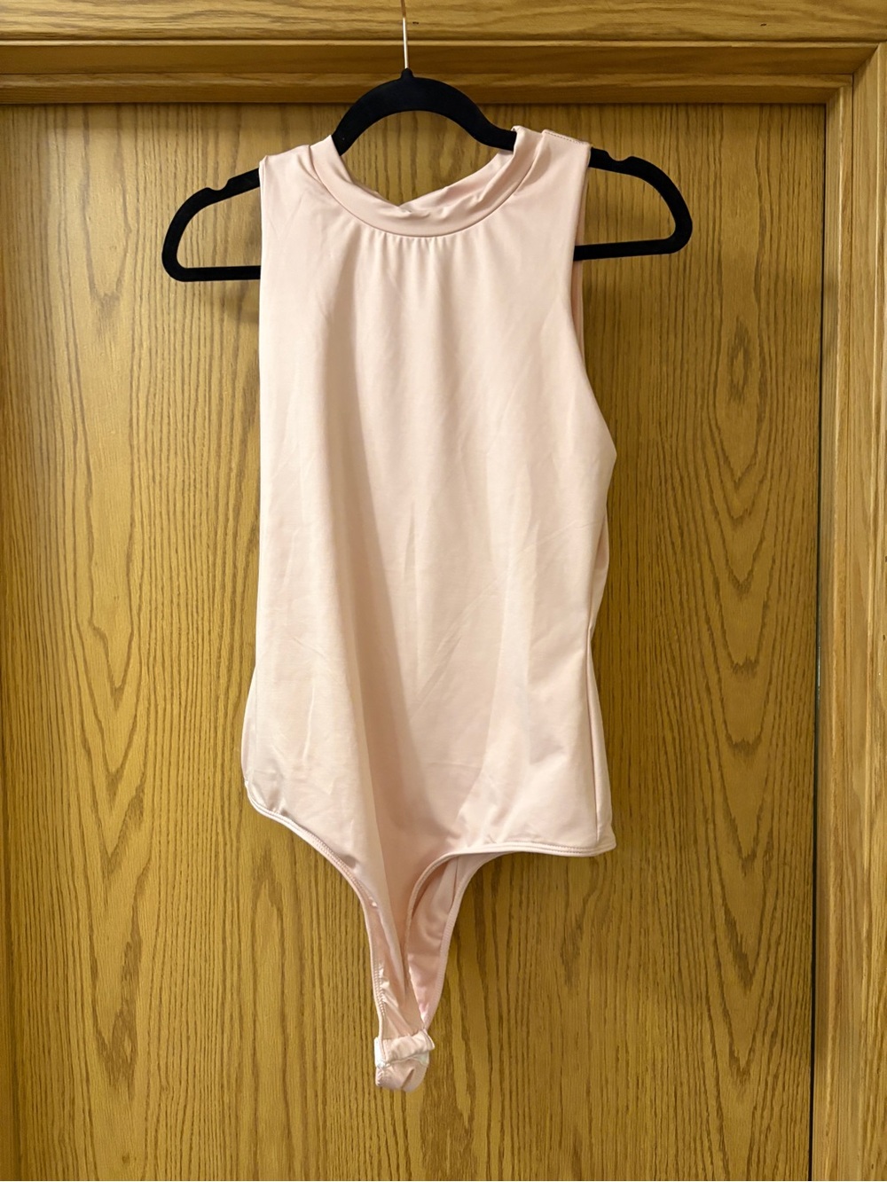 Sleeveless Light Pink Bodysuit with High Neck